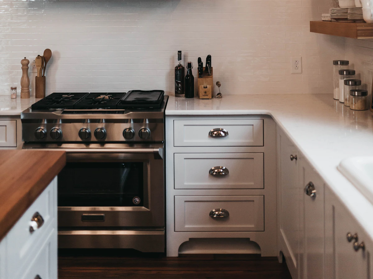 Clean residential kitchen with warm wood cabinets and natural light